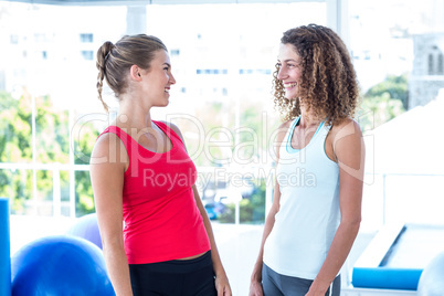 Happy women looking at each other and smiling