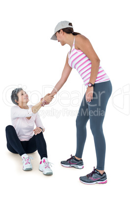 Woman helping happy female friend