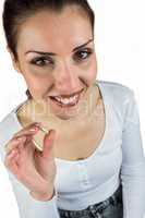 High angle portrait of smiling woman holding pill