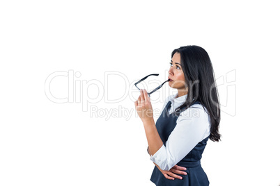 Woman holding her glasses against her lips