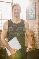 Portrait of an instructor holding clip board