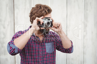 Hipster photographing with camera