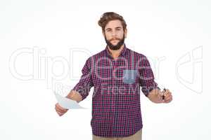 Portrait of confident hipster holding pen and paper