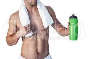 Midsection of a man holding bottle