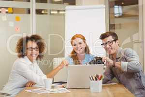 Business people with camera and laptop in meeting