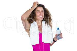 Portrait of happy young woman holding water bottle