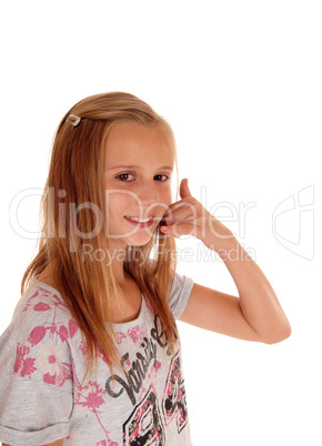 Young girl gesturing a phone call.