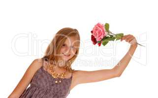 Lovely girl holding up two roses.