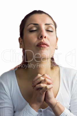 Woman praying with hands together