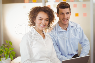 Businesswoman with male colleague