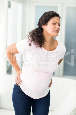 Woman frowning in back pain