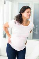 Woman frowning in back pain