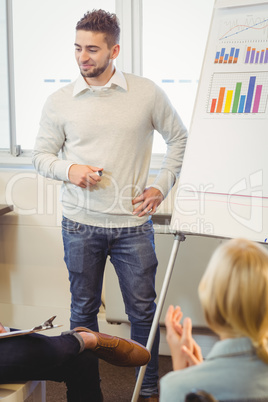 Handsome businessman giving presentation