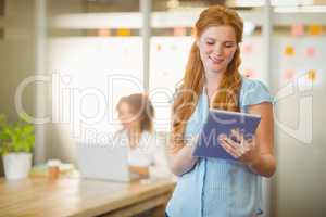 Businesswoman using digital PC