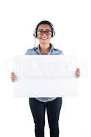 Smiling businesswoman wearing headset and holding white sheet