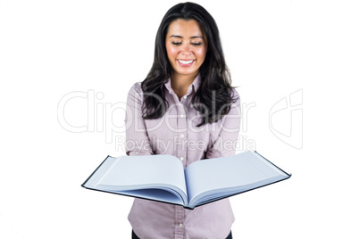 Businesswoman looking at a business ledger