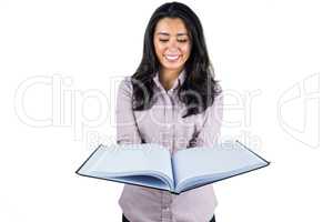 Businesswoman looking at a business ledger