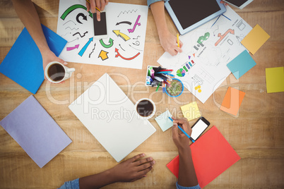 Cropped hands working at desk