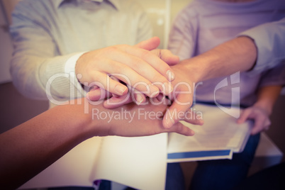 Close-up of business people with hand stack