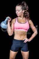 Woman exercising with kettlebell