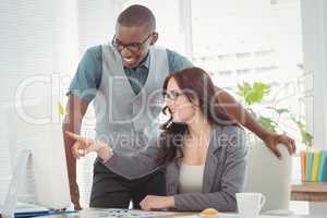 Businesswoman pointing at computer