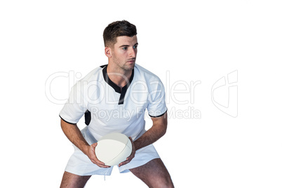 Focused rugby player holding the ball