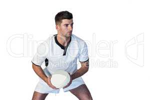 Focused rugby player holding the ball