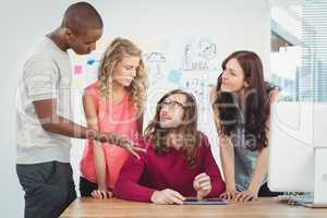 Man gesturing while discussing at desk