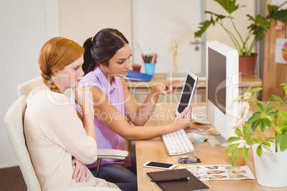 Businesswomen using digital tablet