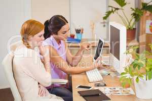 Businesswomen using digital tablet