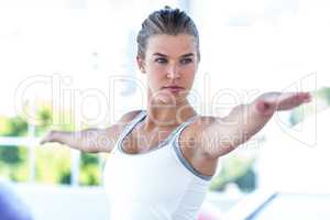 Focused woman with arms outstretched