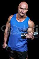 Portrait of man lifting dumbbells