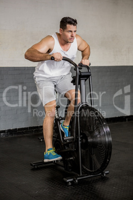 Man riding exercise bike