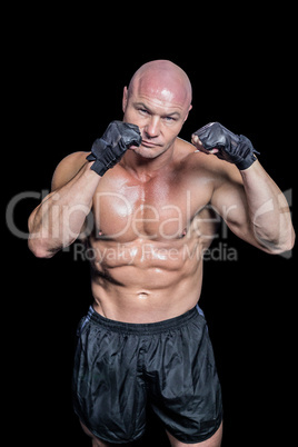 Portrait of bald muscular man