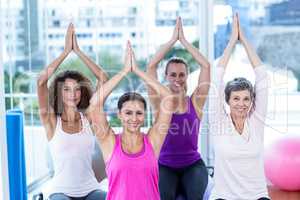 High angle portrait of smiling women with joined hands