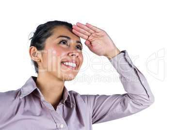 Businesswoman looking upwards with hands on head