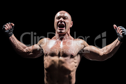 Angry fighter with arms outstretched