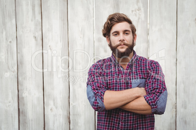 Confident hipster with arms crossed
