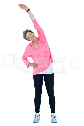 Portrait of mature woman stretching