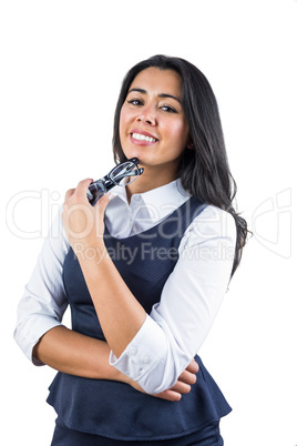 Woman holding her glasses against her chin