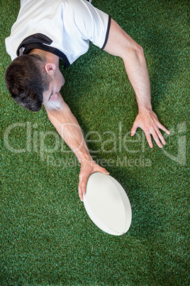 High angle view of man holding rugby ball