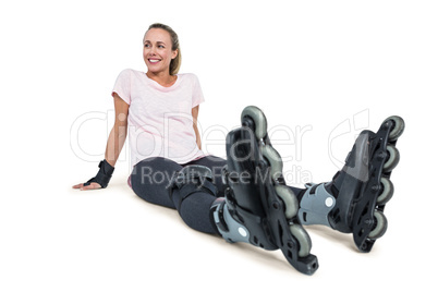 Cheerful female inline skater relaxing