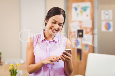 Businesswoman texting on phone