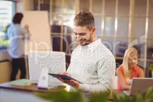 Happy businessman using digital PC