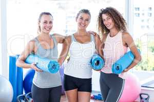 Portrait of women smiling in fitness studio