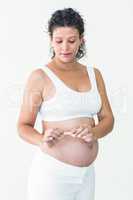 Pregnant woman breaking cigarette