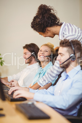 Businesswoman interacting female employee