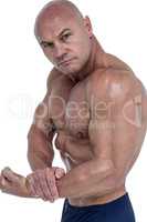 Portrait of man flexing muscles