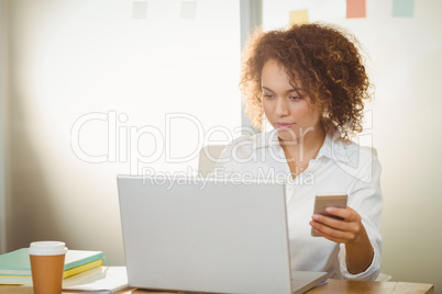 Businesswoman working on laptop