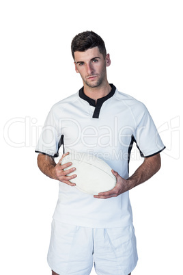 Portrait of player holding rugby ball